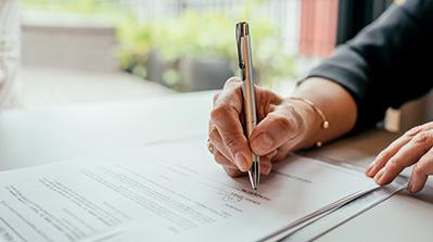 Member signing application document.