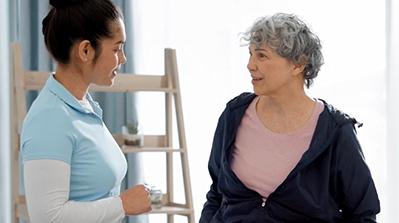 Nurse talking to patient.