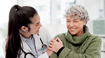 Doctor laughing with patient.